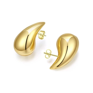 Detail shot of hollow teardrop earrings with high-polish 18K gold finish and butterfly backs