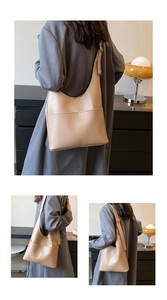 Macro detail of high-capacity tote bag with lychee texture and adjustable shoulder strap