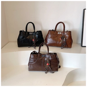 Retro leather shoulder bags in black, tan and dark coffee with metal twist locks