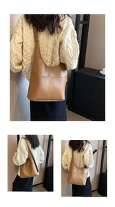 Macro detail of tan pebble leather tote bag showing high-quality texture and stitching