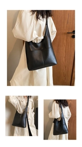 Detailed views of a black pebbled leather tote bag worn with a casual trench coat