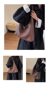 Close-up of brown woven tote bag showing detailed leather texture and stitching