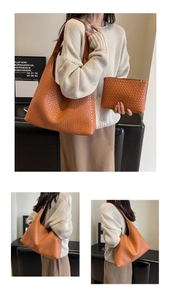 Detail of brown woven tote and pouch set showing the premium texture and craftsmanship