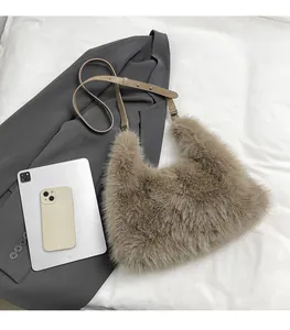 Detailed size comparison of the plush shoulder bag next to a tablet and a smartphone