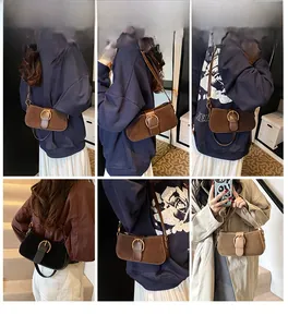 Three vintage suede underarm bags in brown, black, and beige with gold horseshoe buckles
