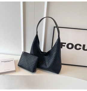Detail of black woven leather tote set with hobo bag and matching zippered pouch