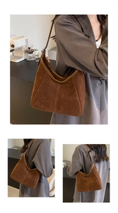 Detail of dark caramel suede hobo bag with vintage stitching and large capacity