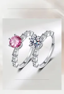 Detail of pink and white faux diamond rings with six-prong setting and s925 silver finish