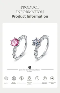 Detail of silver crown rings with sparkling pink and white cubic zirconia stones