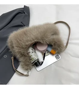 Fuzzy shoulder bag showing spacious interior with iPad, umbrella, and daily essentials