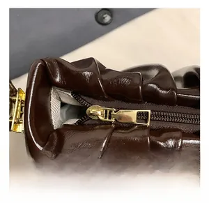 Close-up of the vintage cloud bag showing golden zipper and soft pleated leather