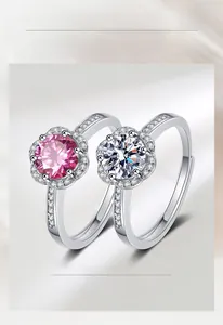 Detail of pink and white moissanite flower rings with adjustable open band design