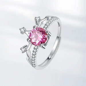 Elegant crown ring with a sparkling pink center stone and silver-tone gemstone setting