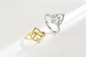 Macro detail of crown rings in gold and silver finish with marquise cut stones