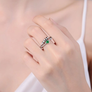 Double-layered silver heart ring with green gemstone and spinning beads for stress relief