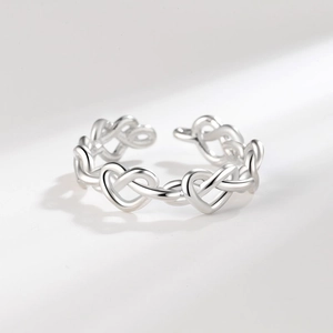 Polished silver interwoven heart chain ring with adjustable open design for women