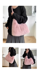 Detailed view of pink faux fur shoulder bag with soft plush texture and leather strap