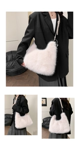 Detail of pink faux fur crossbody bag with thin leather strap and silver hardware accents