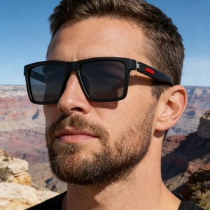 Close-up of polarized square sunglasses for men featuring a unique red temple detail