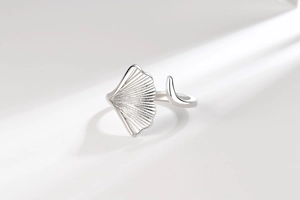 Detailed close-up of a silver ginkgo leaf open ring with realistic vein texture