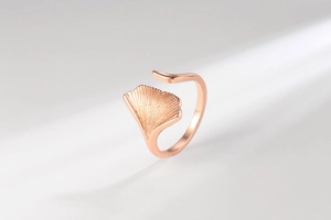 Detailed close-up of rose gold ginkgo leaf ring showing delicate metal leaf texture