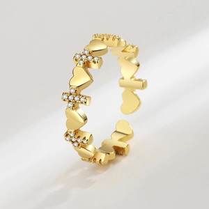 Adjustable gold ring with crystal heart and cross elements for a minimalist fashion look