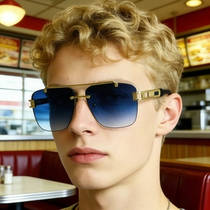 Close-up of men wearing square rimless sunglasses with blue lenses and gold metal frames