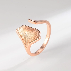 Elegant rose gold ginkgo leaf open ring with detailed vein texture on white background