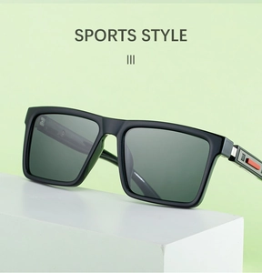 Close-up of sports style square sunglasses with silver hinge and red-grey temple detail