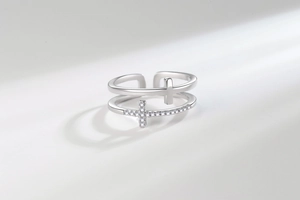 Close-up of double layer silver ring with pavé zircon crosses and adjustable open band