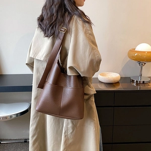 Large brown lychee grain leather tote bag with adjustable shoulder strap for women