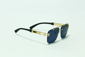 Detail of square rimless sunglasses with gold double bridge and faux wood temples