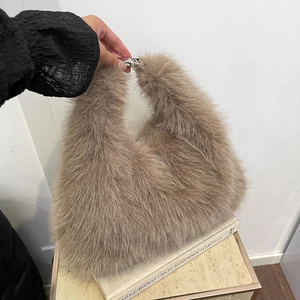 Chic plush faux fur handbag for women with silver metal clasp and soft fuzzy texture