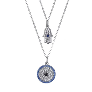Macro detail of silver double-layered Hamsa hand and Evil Eye pendants with pavé zircon stones