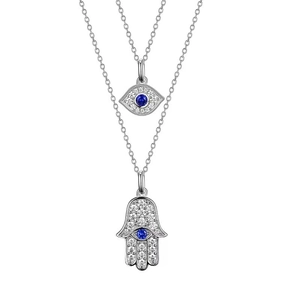 Detailed close-up of Hamsa Hand and Evil Eye pendants with blue crystal inlay