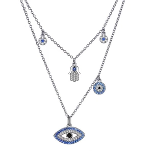Detailed view of silver double-layered necklace with Hamsa hand and evil eye pendants