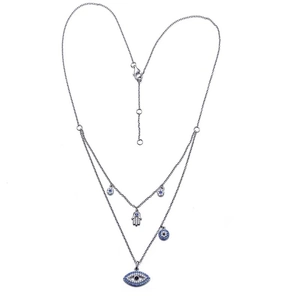 Double-layer silver necklace featuring Hamsa Hand and Evil Eye charms with blue crystals