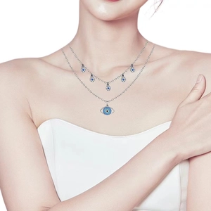 Double-layer evil eye necklace with blue enamel charms on a silver-tone chain