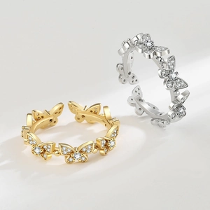 Bagues papillon réglables en finitions or et argent avec des pierres de zircon brillantes