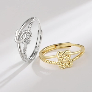 Double heart twisted rope ring in gold and silver finish with adjustable open band