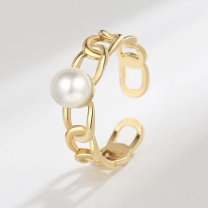 Adjustable gold chain ring with 'CD' link design and a central white pearl