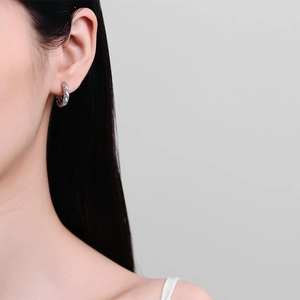 Vintage rainbow zircon micro-pave hoop earrings in S925 silver worn by a model