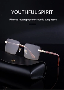 Detail of rimless rectangle photochromic sunglasses with wood grain temples and gold bridge