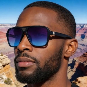 Detail of square polarized sunglasses featuring gradient lenses and metal bridge accents