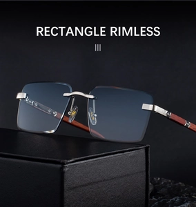 Detail of rimless rectangle sunglasses with dark gradient lenses and wood-grain temples