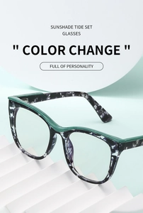 Detail of cat eye frame with black and white ink texture and green accents