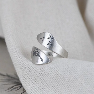 Macro shot of S925 sterling silver dandelion ring with brushed matte texture finish