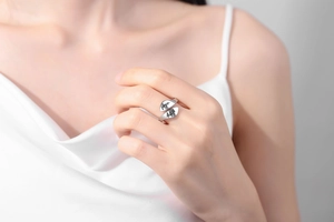 Macro view of silver adjustable ring with engraved mountain and forest silhouettes