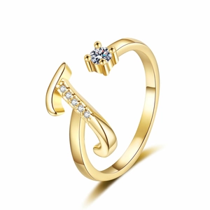 Macro shot of gold adjustable ring featuring letter J design with sparkling cubic zirconia