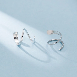 Elegant silver double-layer spiral hoop earrings with a modern minimalist twist design